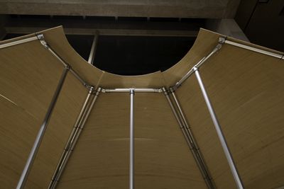 Looking up at three pavilion modules joined to form a hemicircle
