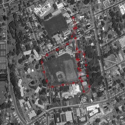 A red hiking-path-style loop, on a monochrome satellite image of Wesleyan University.